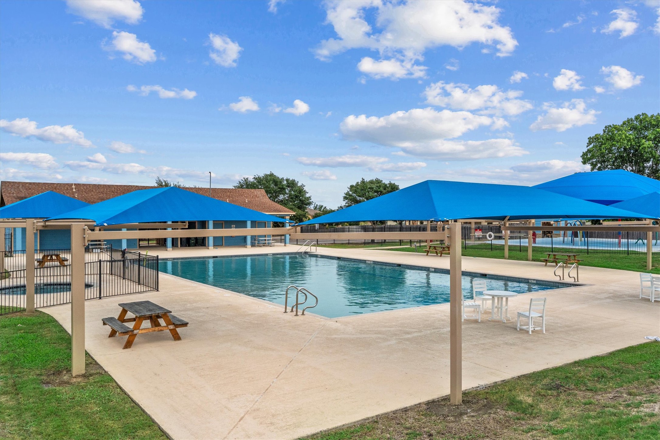 172 Discovery Kyle, TX 78640 - Photo 18 of 21 Community splash pad with covered seating, offering a fun space to cool off during the summer.