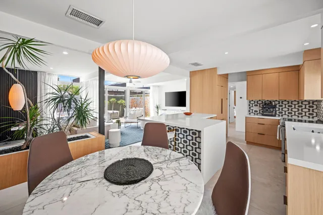 a view of kitchen with dining table and chairs