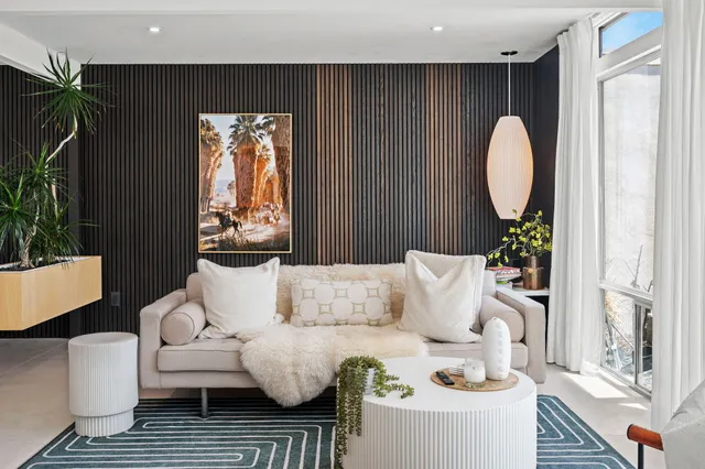 a dining room with furniture and wooden floor