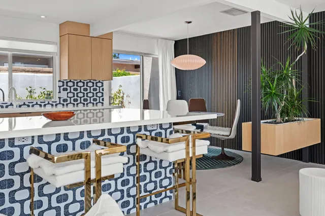 a view of a kitchen counter space and breakfast area