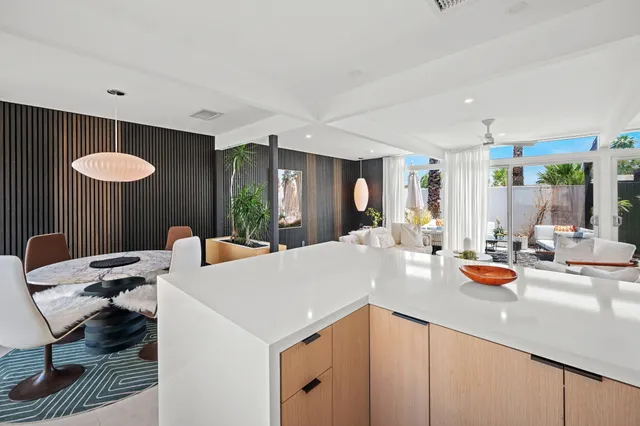 a bedroom with bed and a chandelier