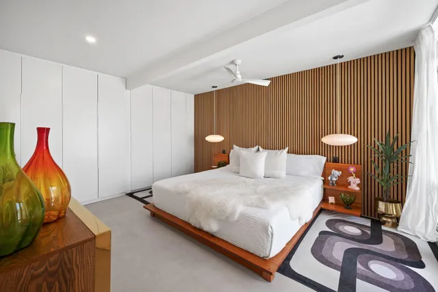 a view of a livingroom with furniture and iron gate