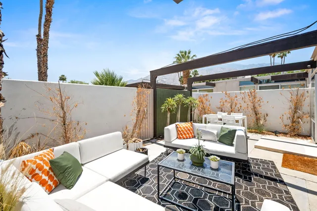a view of a swimming pool with a lounge chairs