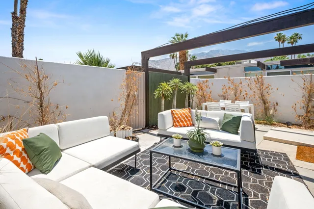 a swimming pool with outdoor seating