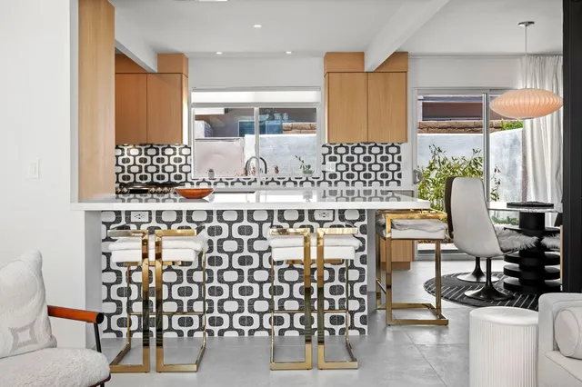 a bathroom with a sink mirror and a shower