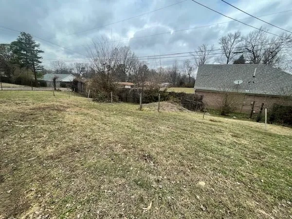 a view of outdoor space with deck and yard