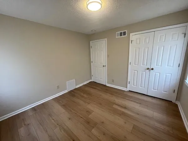 a view of a livingroom with wooden floor
