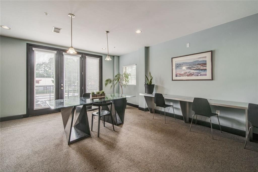 5300 Peachtree Road, Unit 2604 Atlanta, GA 30341 - Photo 10 of 39 a view of a livingroom with furniture and a floor to ceiling window