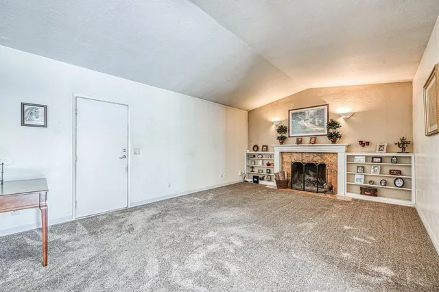a view of a livingroom with a fireplace