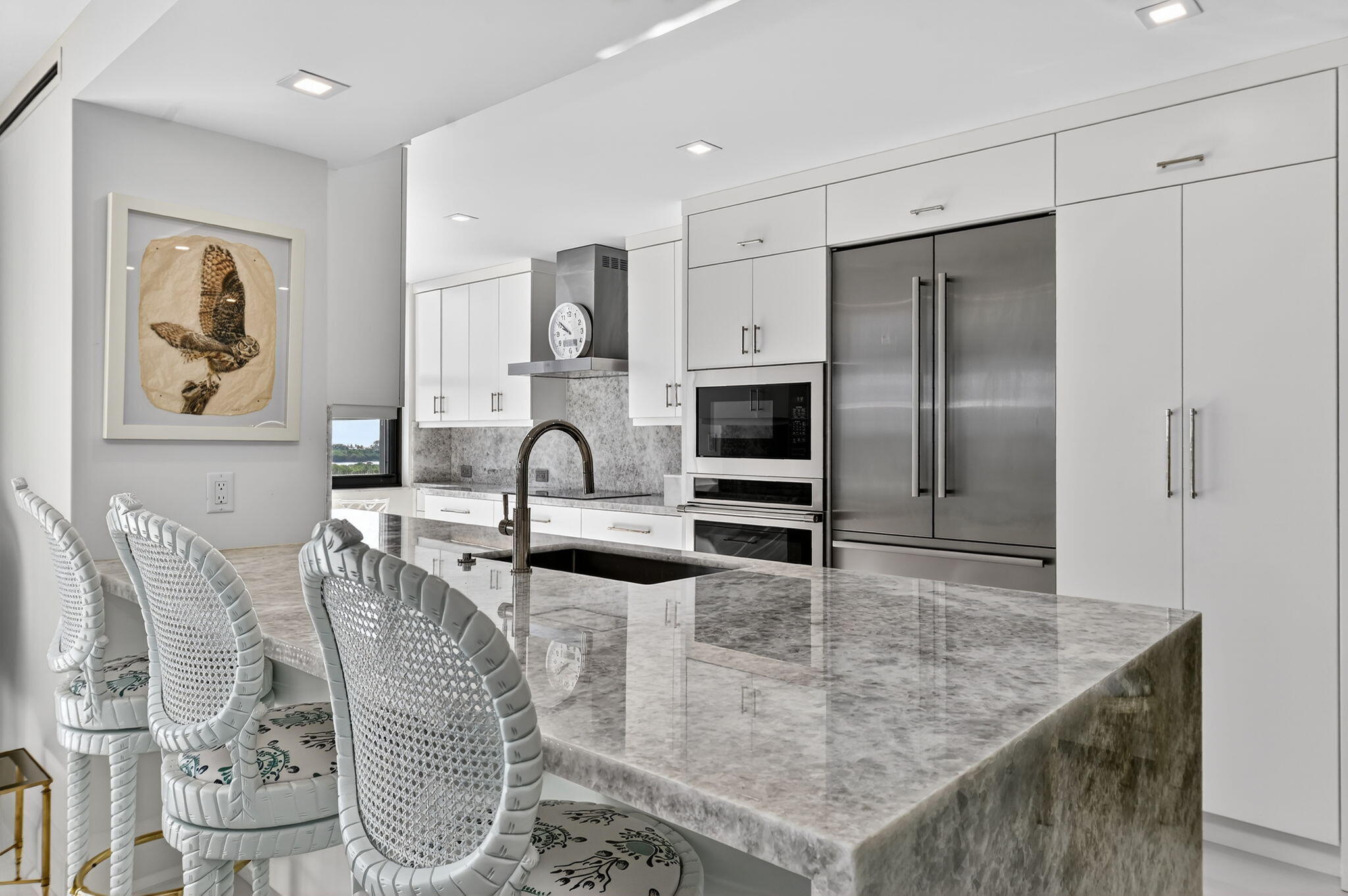 3800 Washington Road, Unit 1107 West Palm Beach, FL 33405 - Photo 16 of 49 a kitchen with stainless steel appliances granite countertop a sink a stove and refrigerator