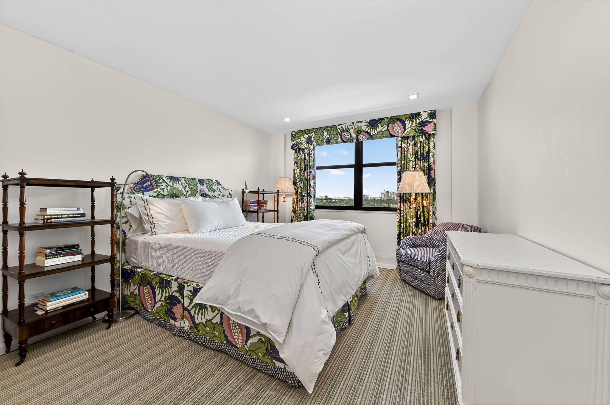 3800 Washington Road, Unit 1107 West Palm Beach, FL 33405 - Photo 29 of 49 a bedroom with a bed a mirror and a window