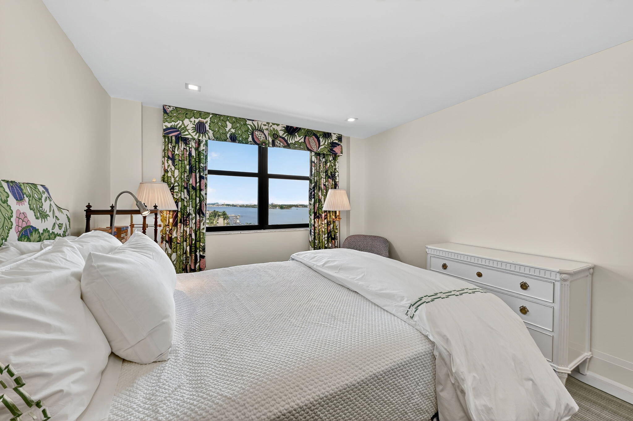 3800 Washington Road, Unit 1107 West Palm Beach, FL 33405 - Photo 30 of 49 a bedroom with a large bed and a window with outer view