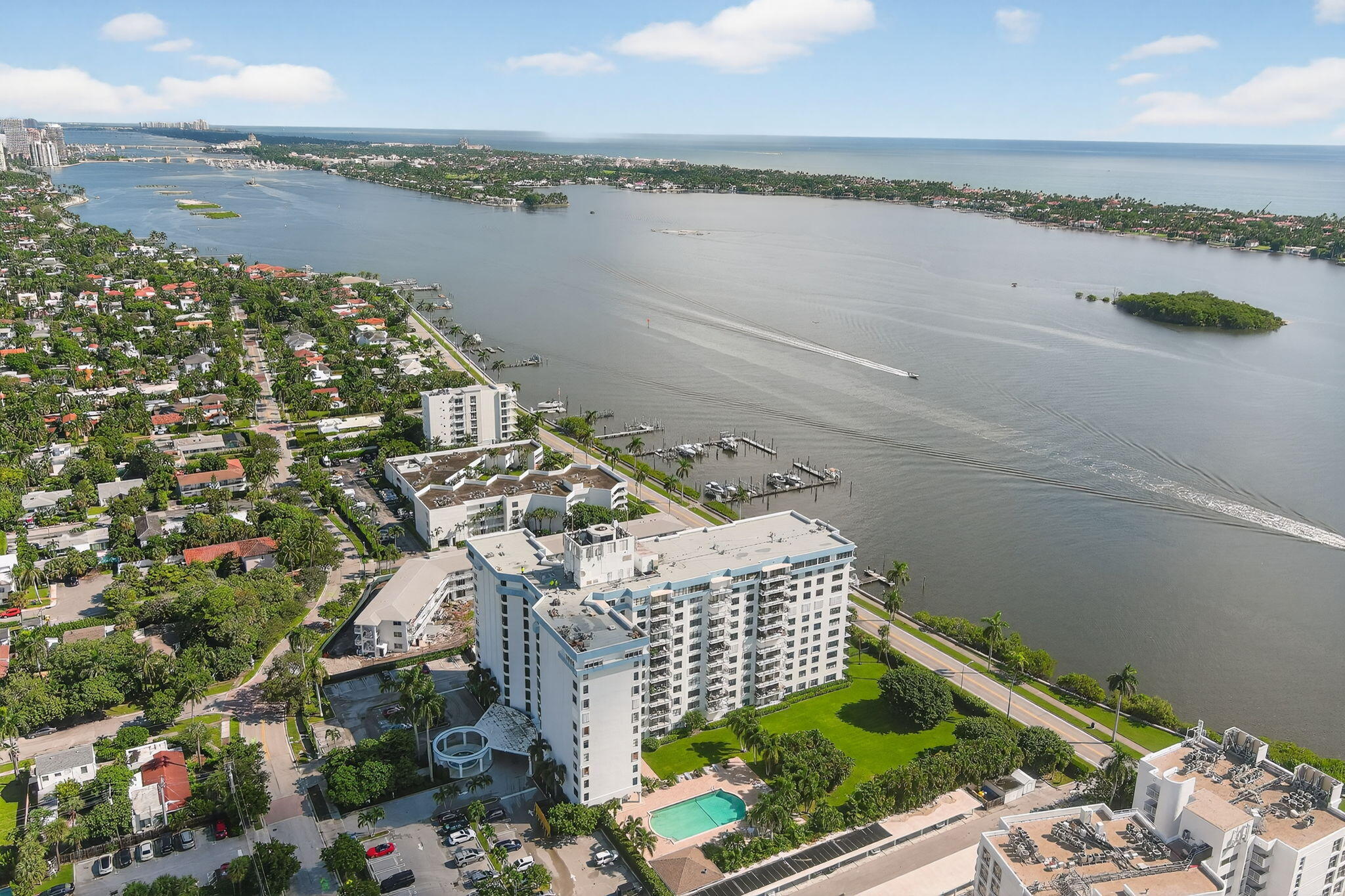 3800 Washington Road, Unit 1107 West Palm Beach, FL 33405 - Photo 46 of 49 a view of a lake with a city skyline in the background