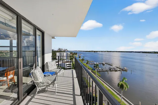 a view of a balcony and chairs