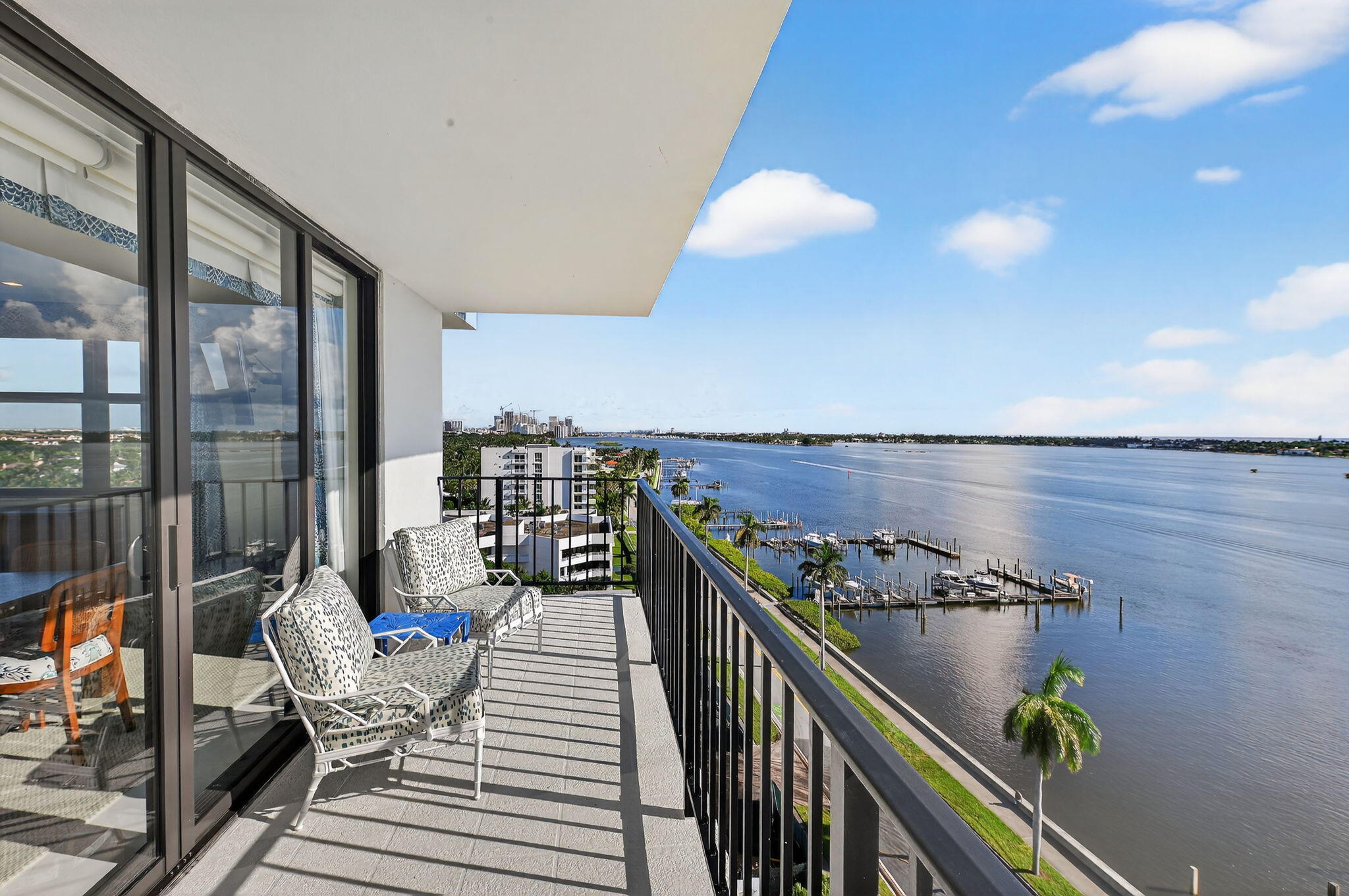 3800 Washington Road, Unit 1107 West Palm Beach, FL 33405 - Photo 8 of 49 a view of a balcony and chairs