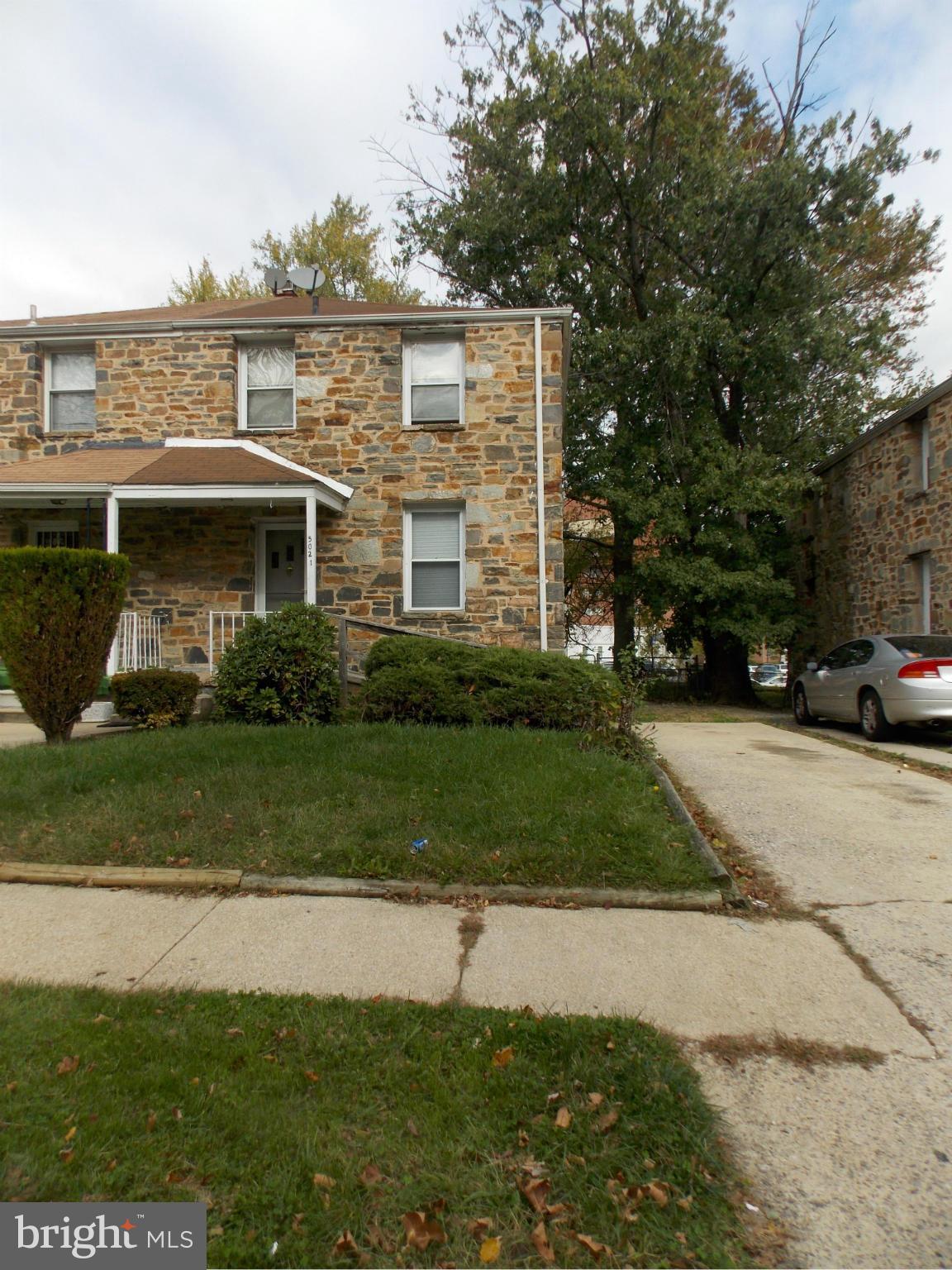 5021 Sunset Road Baltimore, MD 21215 - Photo 2 of 26 a front view of a house with a yard