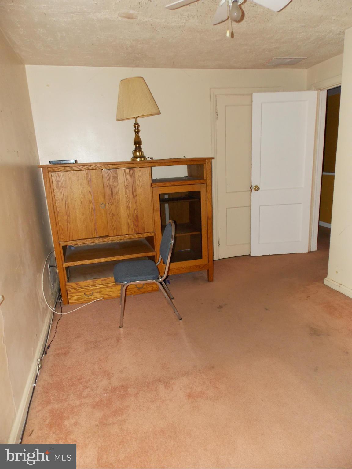 5021 Sunset Road Baltimore, MD 21215 - Photo 11 of 26 a view of an empty room with a fireplace