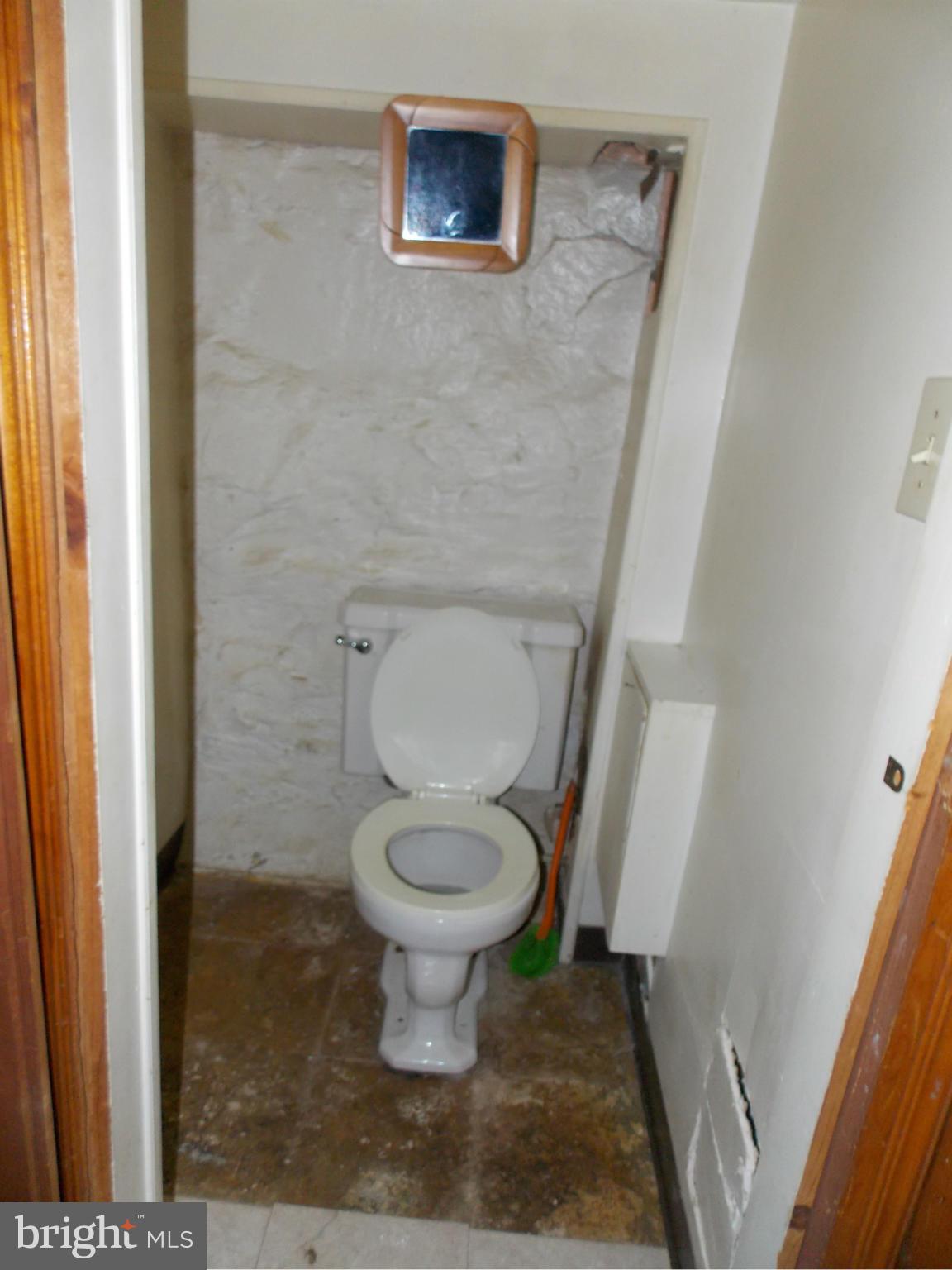 5021 Sunset Road Baltimore, MD 21215 - Photo 17 of 26 a bathroom with a toilet and a shower
