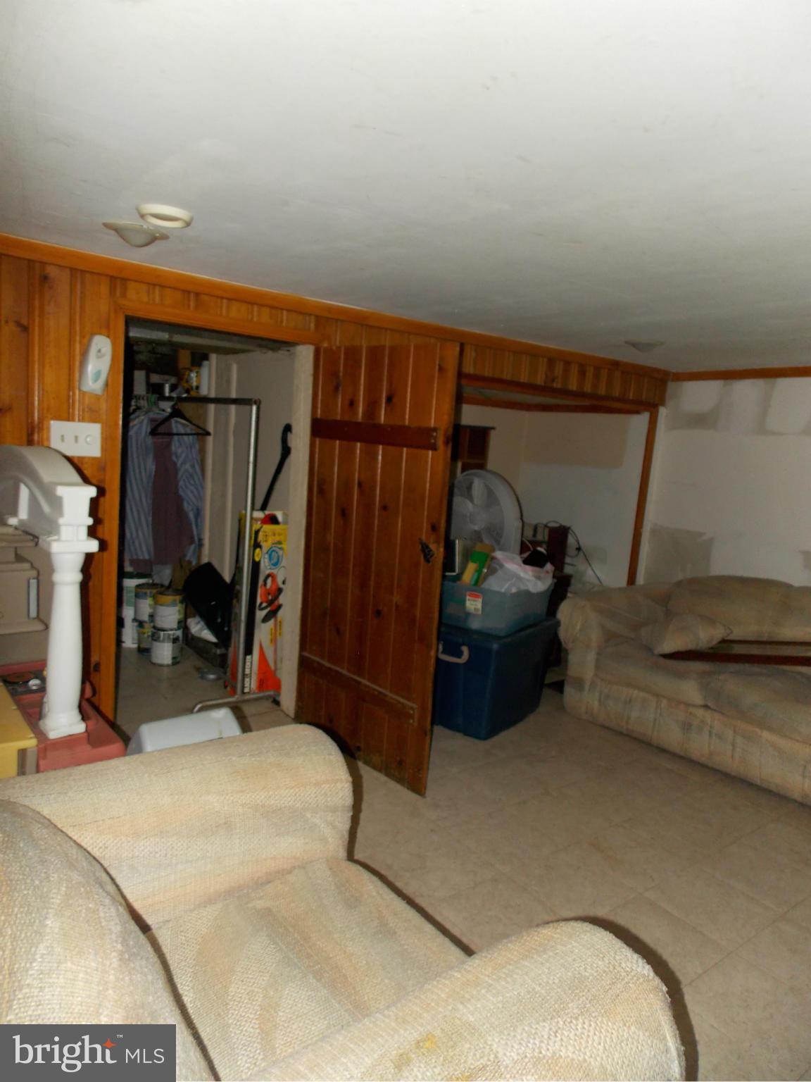 5021 Sunset Road Baltimore, MD 21215 - Photo 19 of 26 a bedroom with furniture and a gym equipment