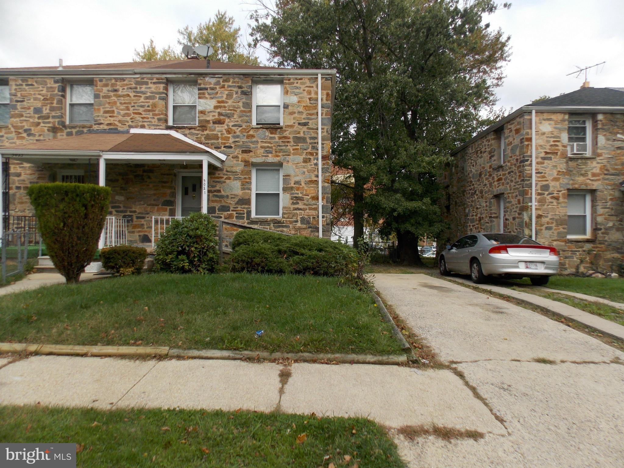 5021 Sunset Road Baltimore, MD 21215 - Photo 3 of 26 a front view of a house with a garden