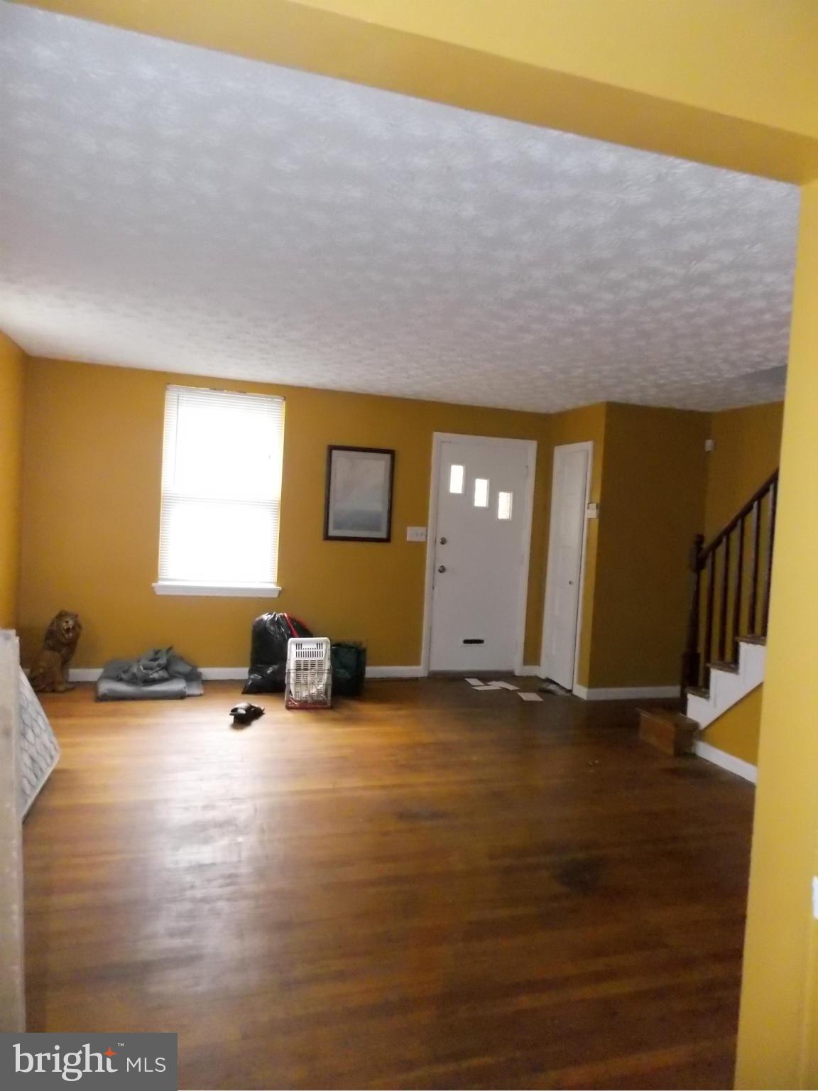 5021 Sunset Road Baltimore, MD 21215 - Photo 5 of 26 a view of a livingroom with a patio
