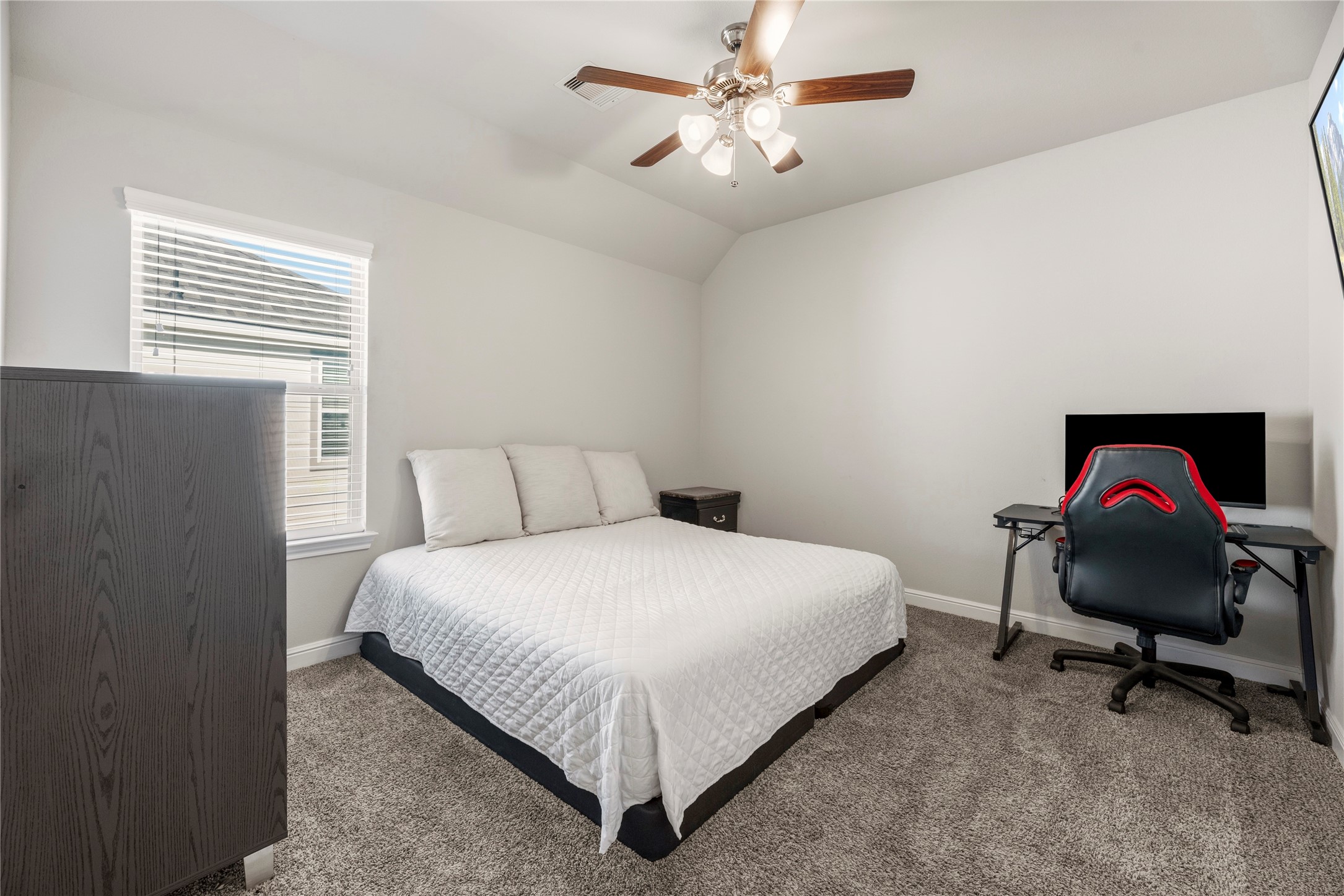 3319 Learning Tree Lane Rosenberg, TX 77471 - Photo 30 of 44 a bedroom with a bed and a chair