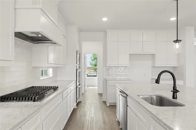 an empty room with wooden floor and window