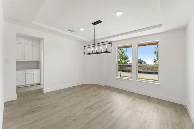 a kitchen with kitchen island a sink stainless steel appliances and cabinets