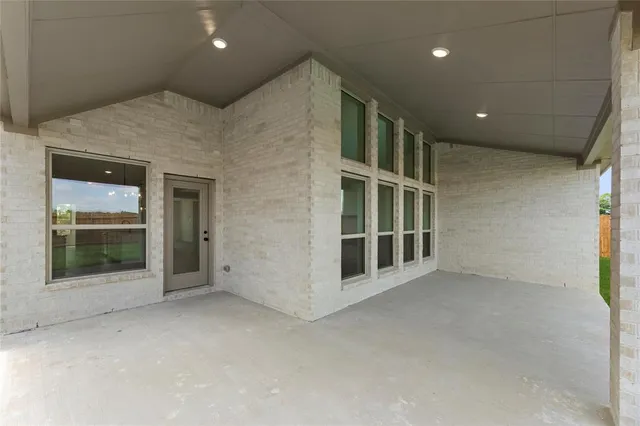 an empty room with lot of projector and screen