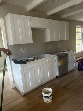 a kitchen with a sink and a stove