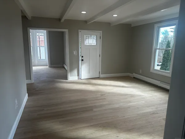 en empty room with windows and closet