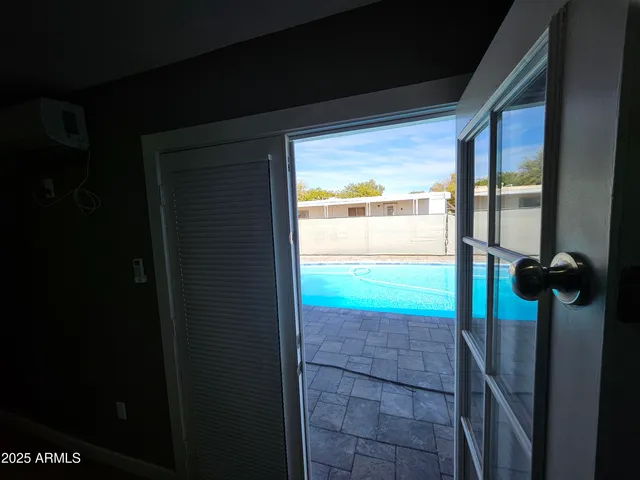 a view of a room with wooden floor