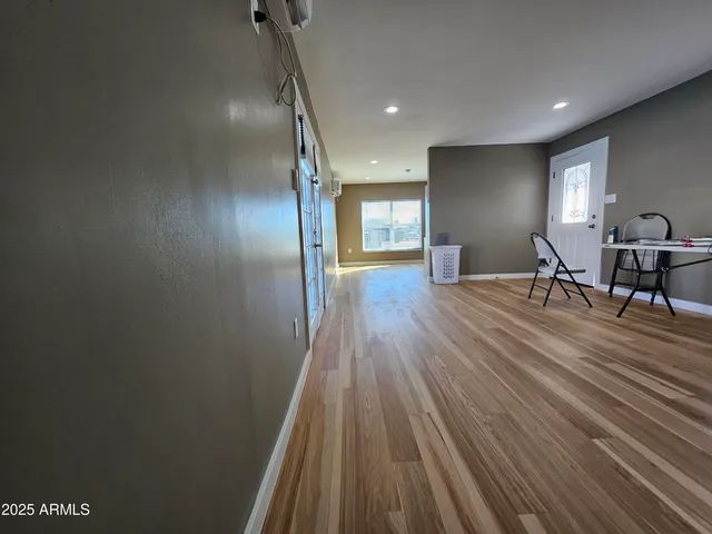 a kitchen with a refrigerator and a stove