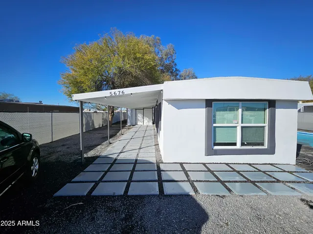 a view of a yard with an outdoor space