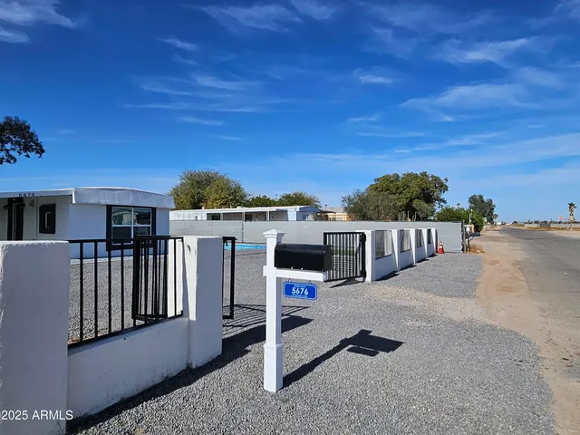 a view of a balcony with chairs