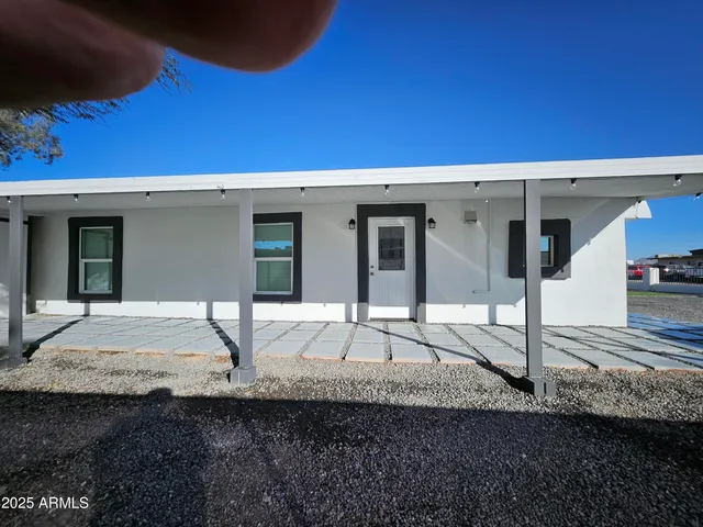 a house with yard in front of it