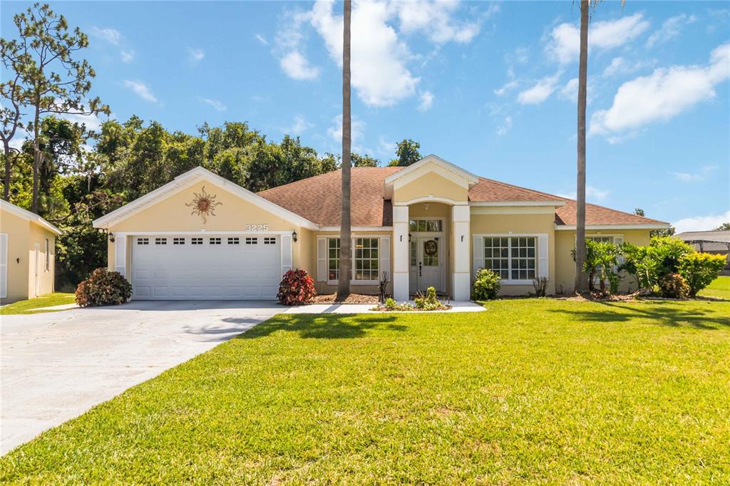 3225 Canoe Creek Road St. Cloud, FL 34772 - Photo 4 of 30 a view of a house with a yard and sitting area