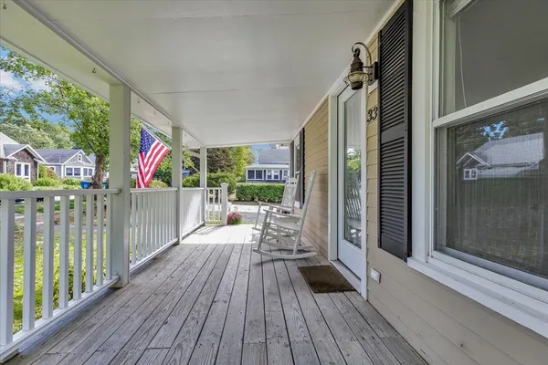 a view of a balcony with wooden floor and outdoor space