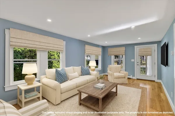 a living room with furniture and a rug