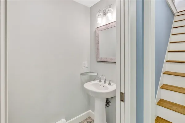 a bathroom with a sink and mirror