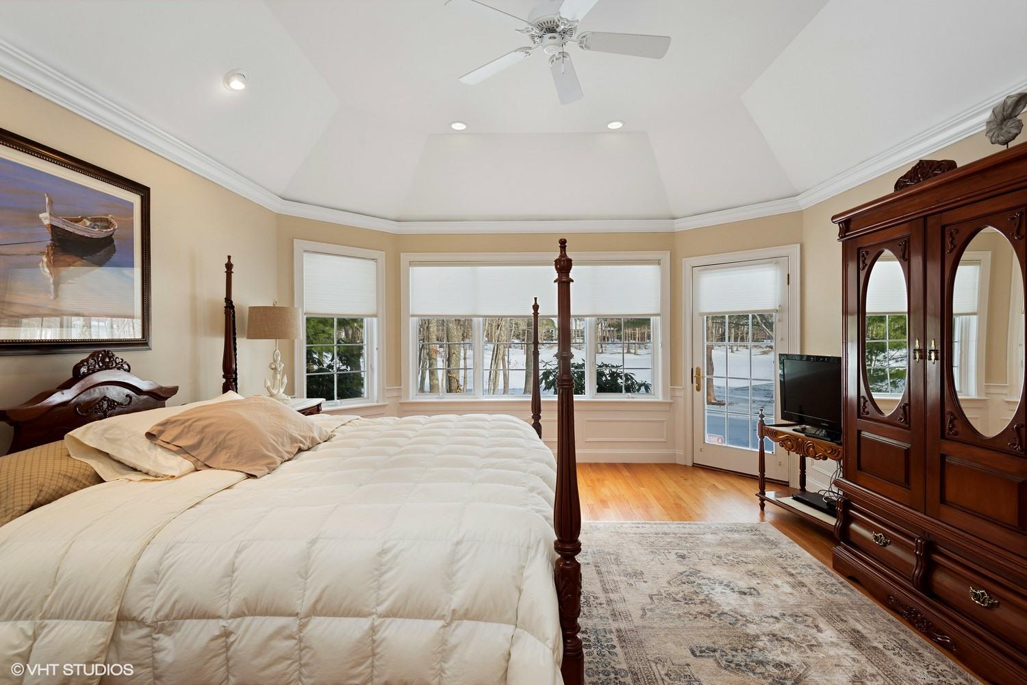 101 Reflection Drive Sandwich, MA 02563 - Photo 10 of 15 a large bedroom with a bed and glass windows