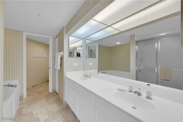 a white toilet sitting next to a small bathroom