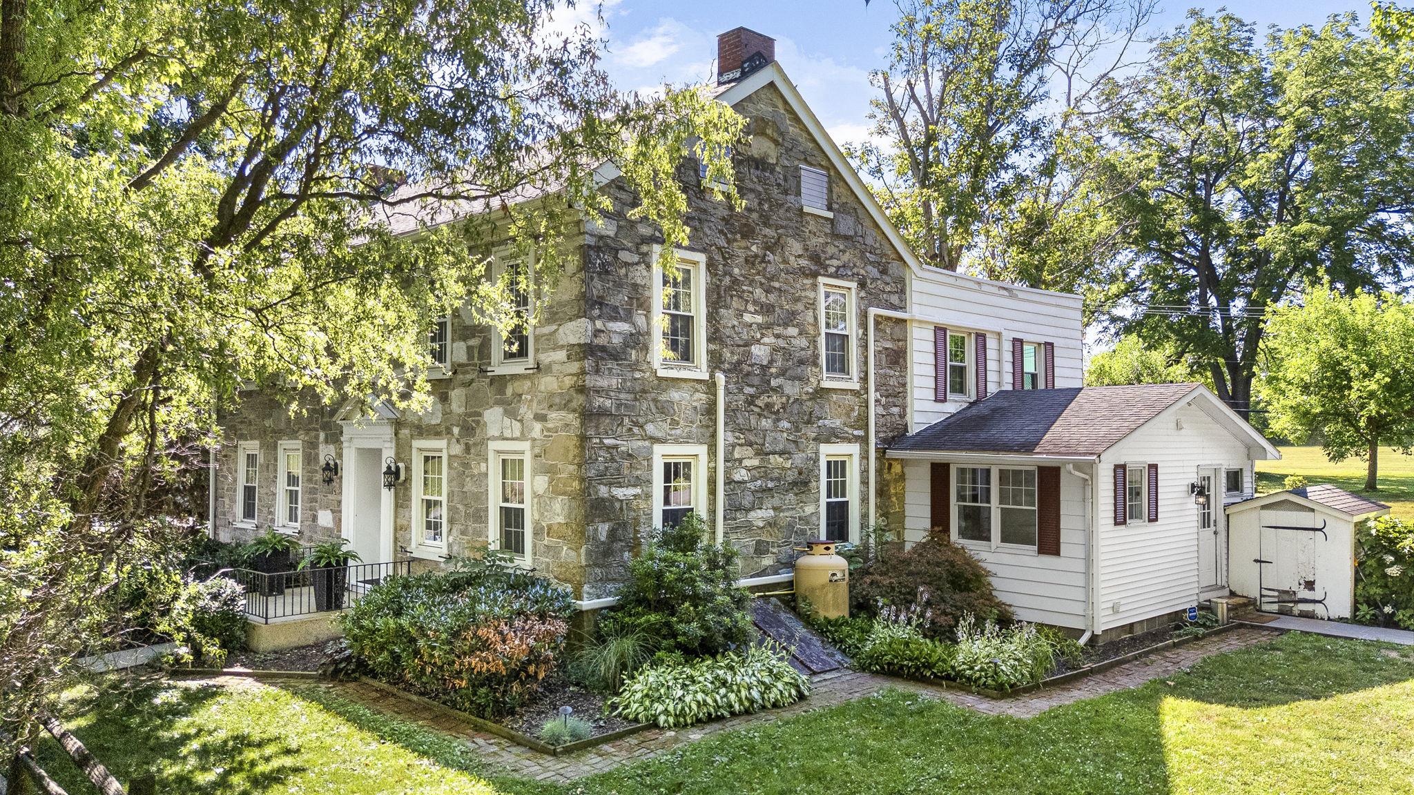 416 Snyder Road Reading, PA 19605 - Photo 9 of 63 Charming stone home with lush greenery.