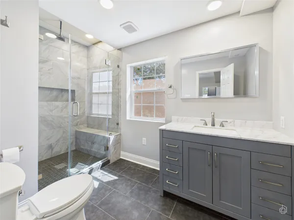a bathroom with a tub and window