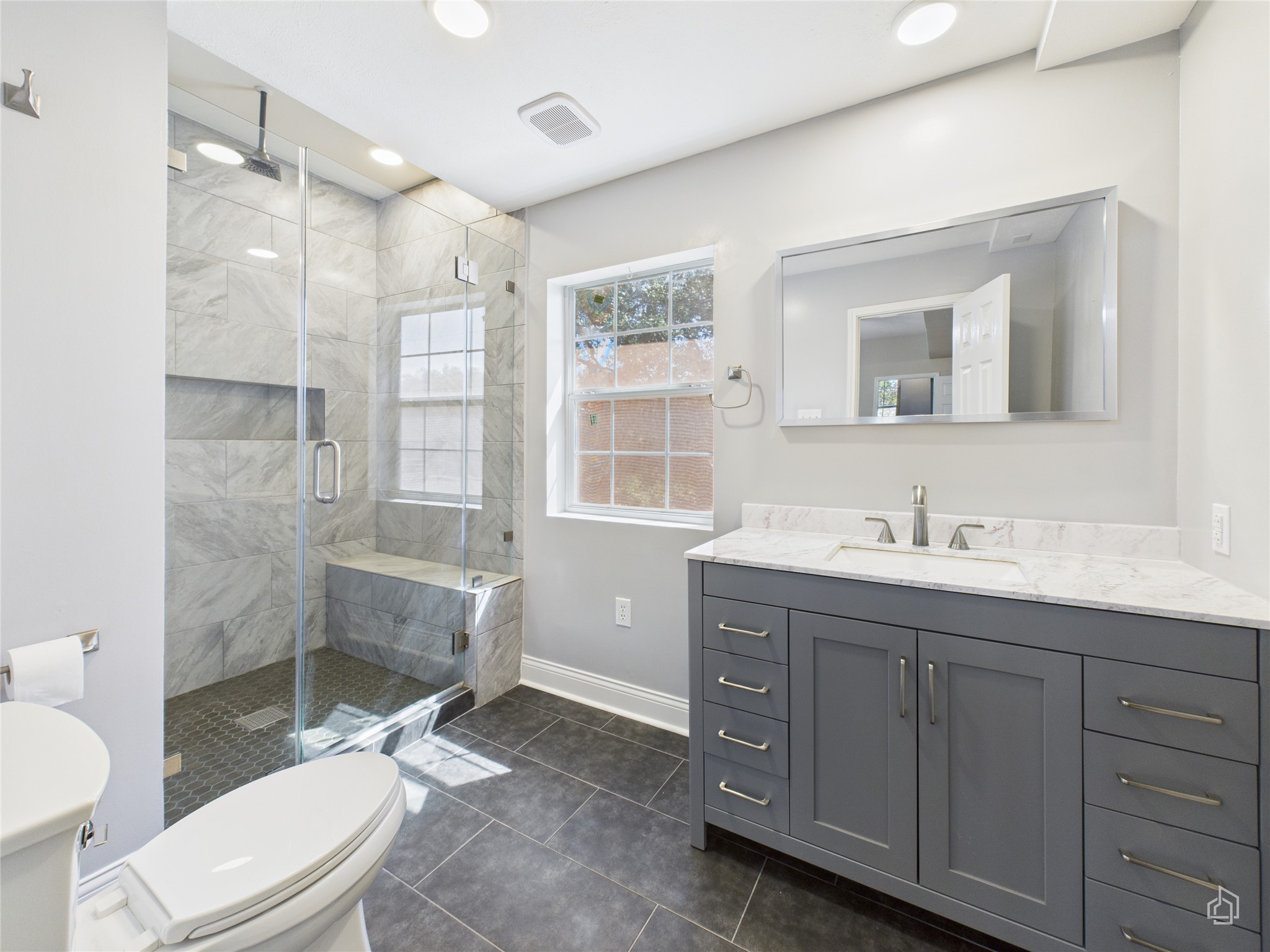 451 High Gabriel East Leander, TX 78641 - Photo 22 of 40 a bathroom with a sink toilet a mirror and shower