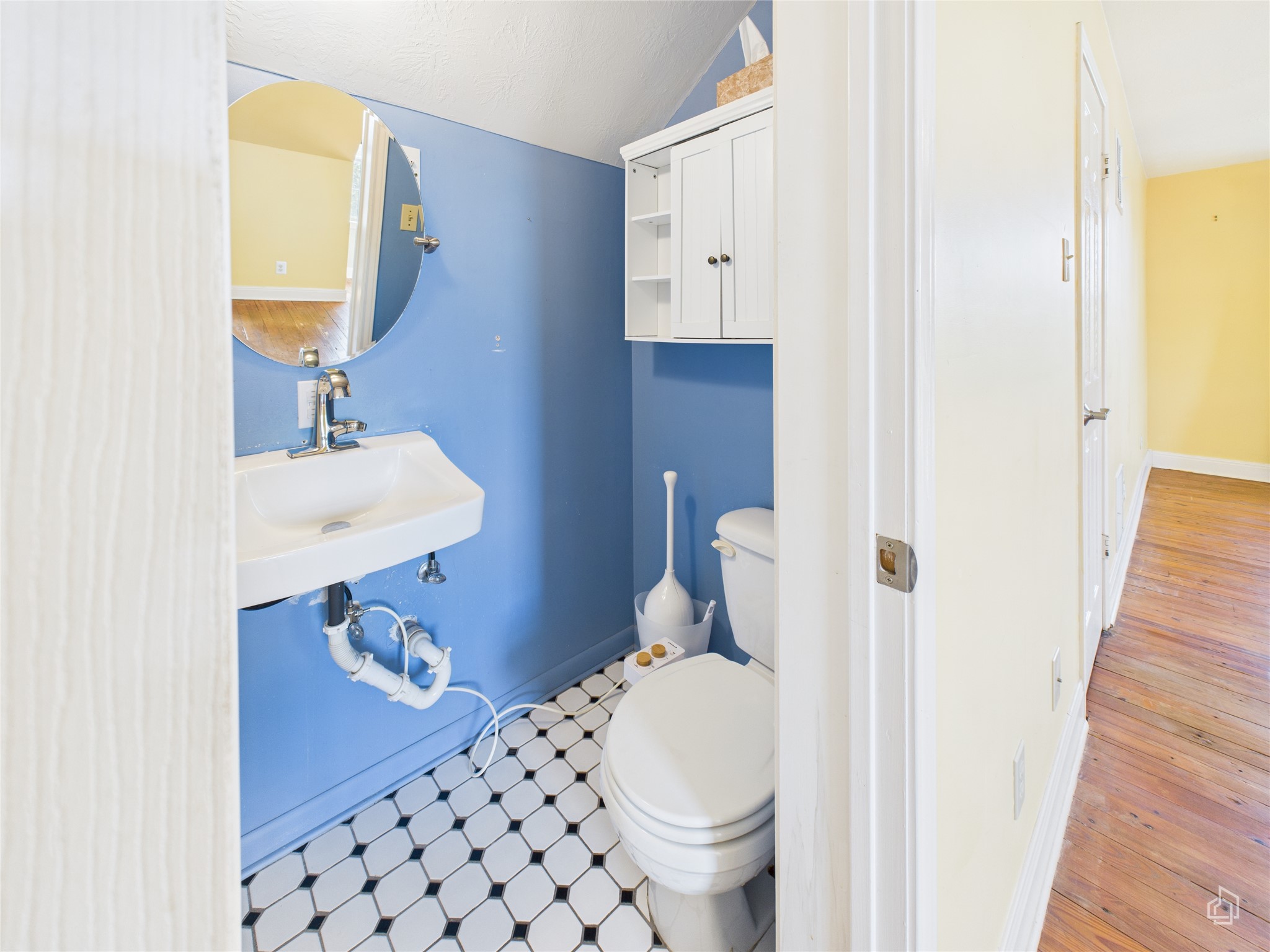 451 High Gabriel East Leander, TX 78641 - Photo 28 of 40 a bathroom with a sink a toilet and a mirror