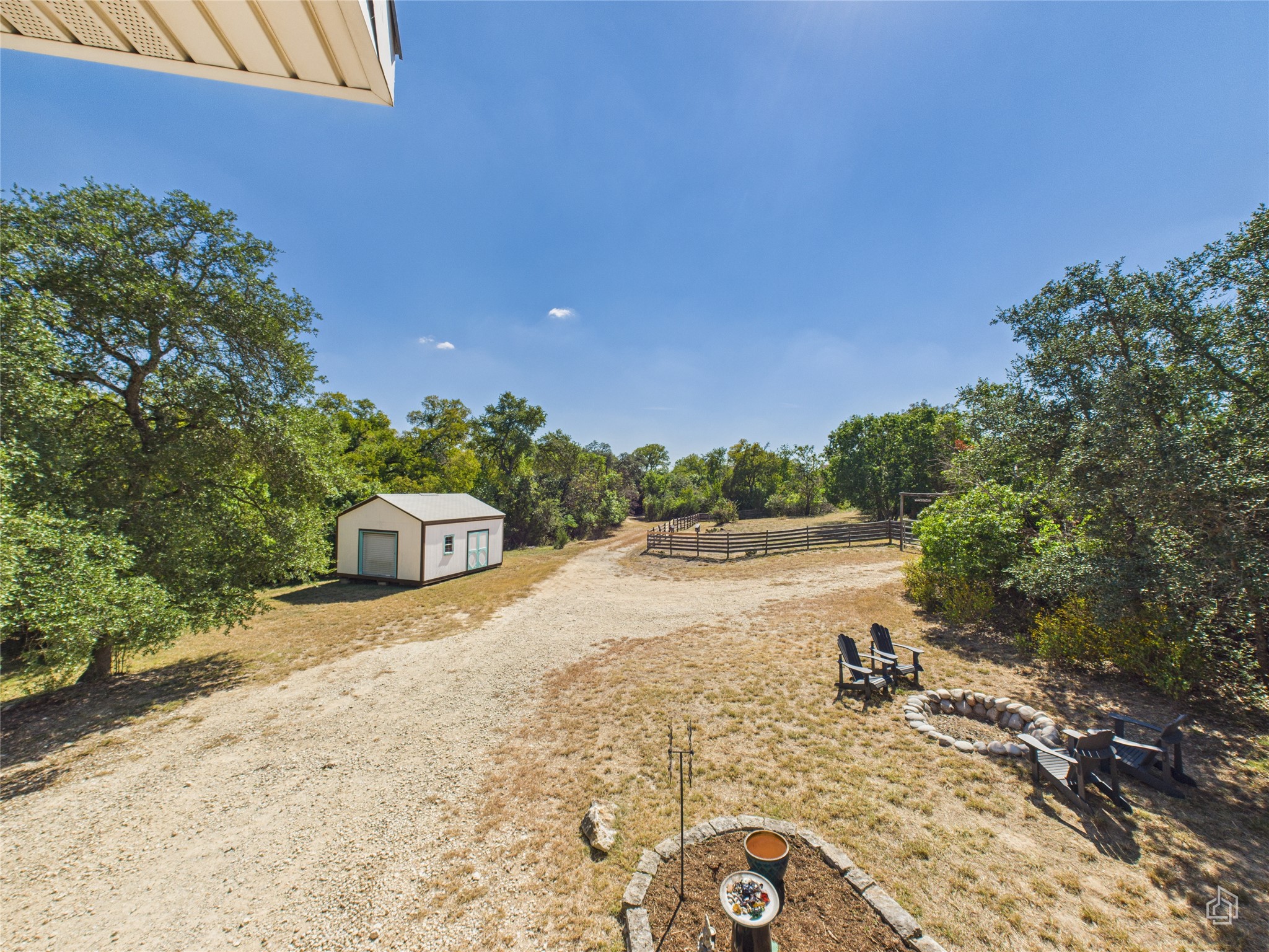 451 High Gabriel East Leander, TX 78641 - Photo 30 of 40 a view of a lake with beach and large trees