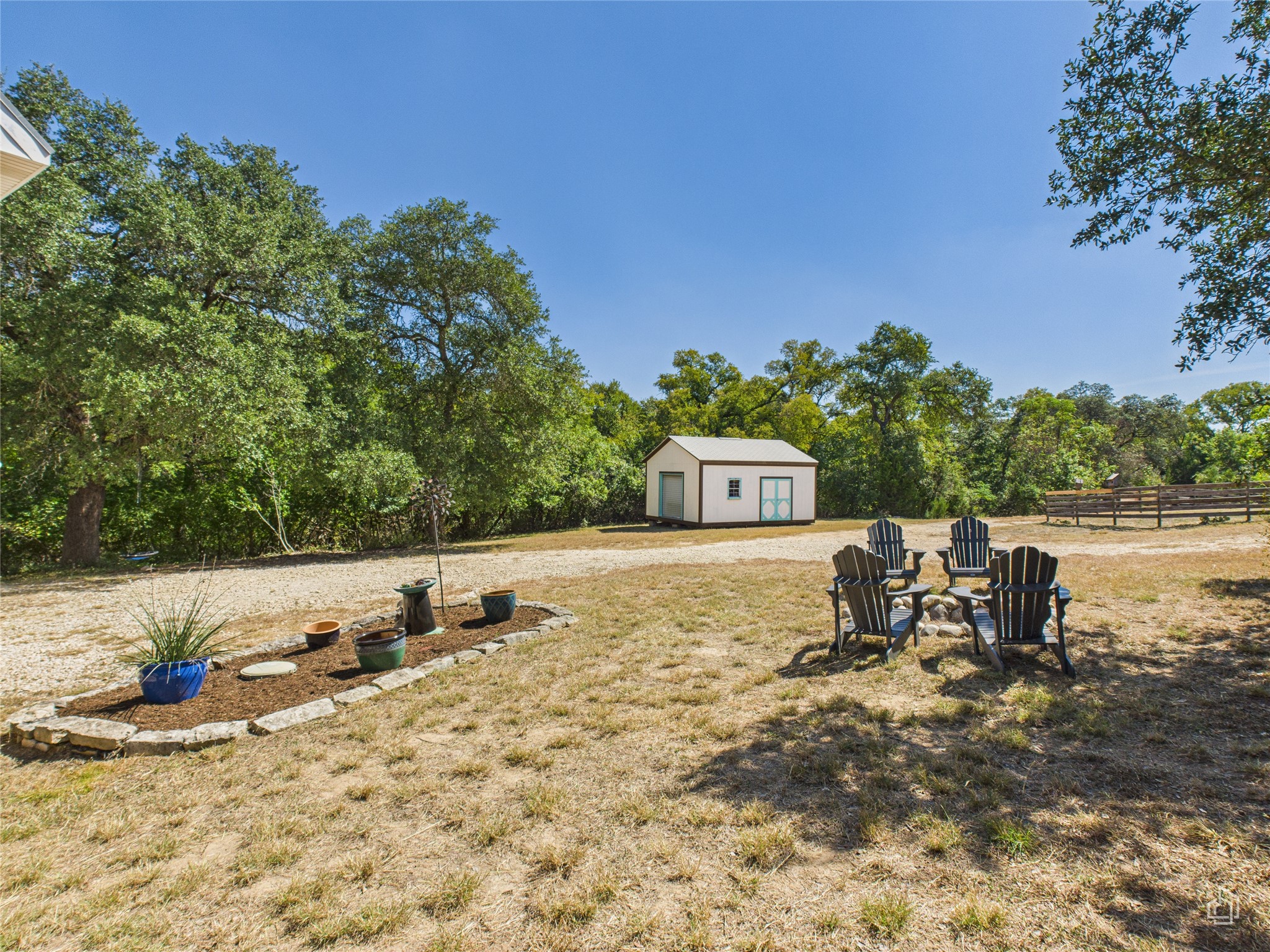451 High Gabriel East Leander, TX 78641 - Photo 32 of 40 a view of a water with a bench in the patio