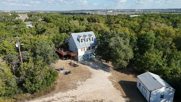 an aerial view of a house with a garden