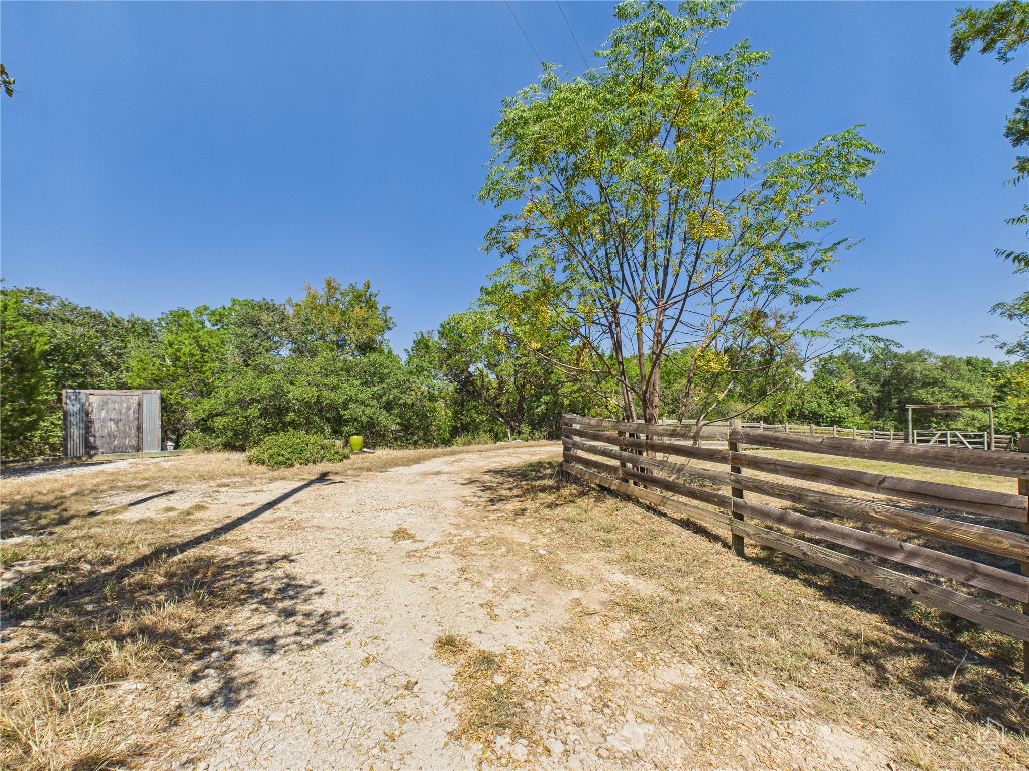 451 High Gabriel East Leander, TX 78641 - Photo 7 of 40 a view of a yard with wooden fence